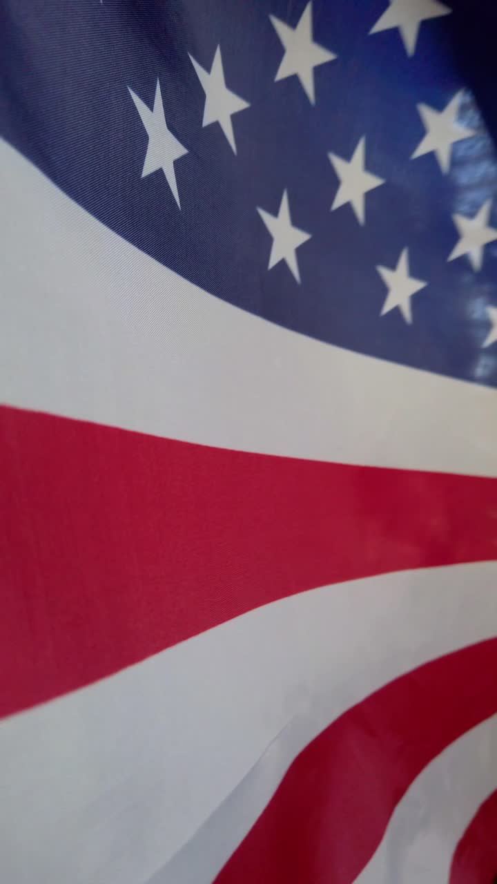 Close-up view of six American flags waving