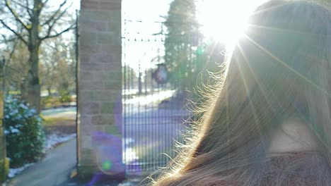 slow motion (120fps): young lady walks into the park (war memorial park) in coventry, united kingdom