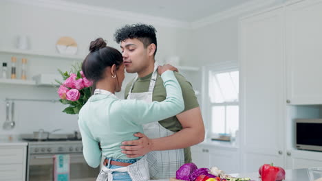 Cooking,-couple-kiss-and-flower-gift-with-kitchen