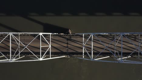 Aerial-view-over-the-top-river-and-bridge-in-Alaska