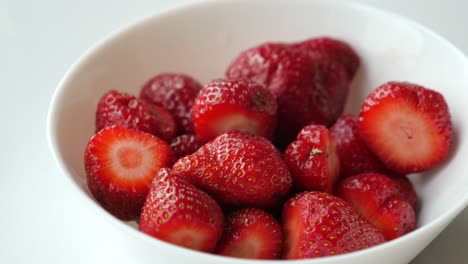 fresh strawberries in a white bowl