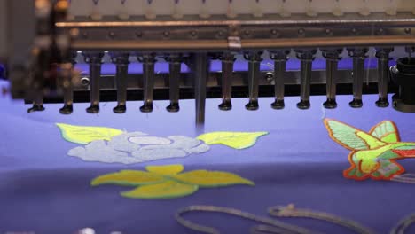 Automatic-industrial-sewing-machine-for-stitch-by-digital-pattern.-Modern-textile-industry.