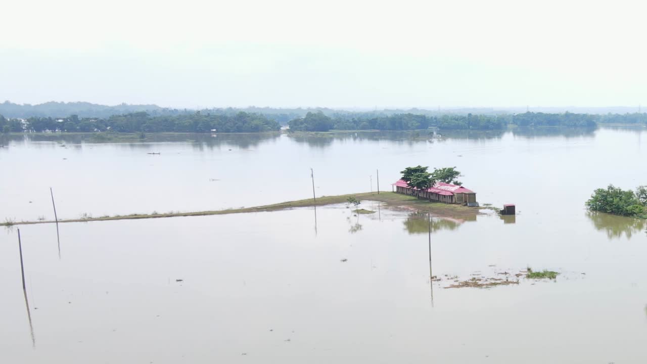 A rural school house submerged by flood water in Bangladesh. Aerial shot - South Asia