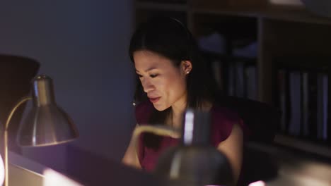 video of asian female consultant working late in office