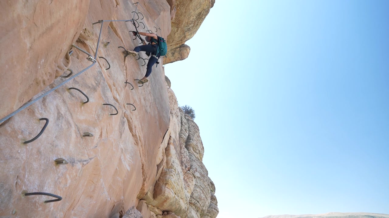 Woman on Via Ferrata Climbing on Rock With Metal Rungs and Rope, Ashley Gorge Utah USA, Low Angle
