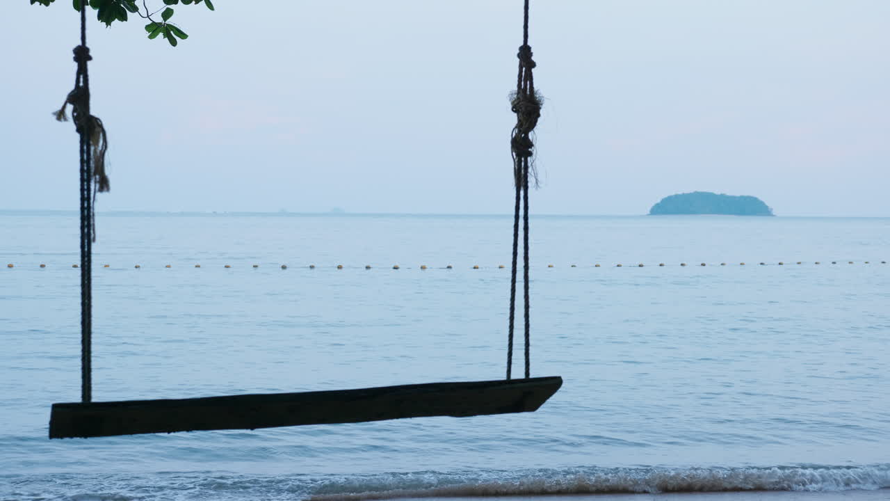 Wooden Swing on a Peaceful Beach