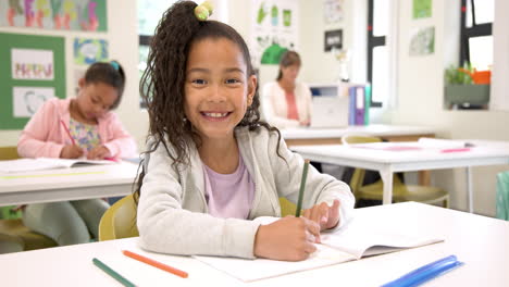 smiling girl writing in notebook at school, enjoying classroom activities