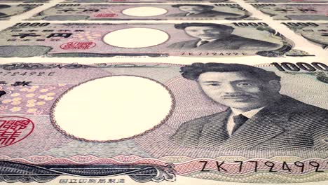 banknotes of one thousand yen japanese rolling on screen, cash money, loop