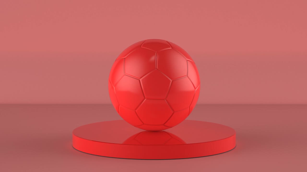 pelota de fútbol roja sobre fondo rojo