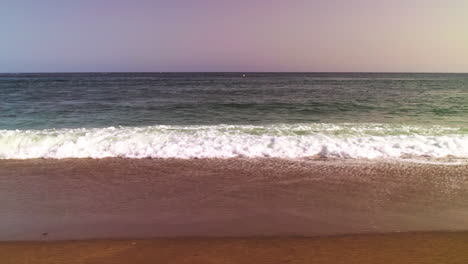 moving along an empty beach on the mediterranean sea