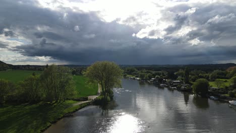 River-Thames-at-Bourne-End-sun-shining-off-water-UK-Buckinghamshire-Aerial-footage