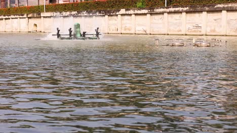 water turbine in action by the riverbank