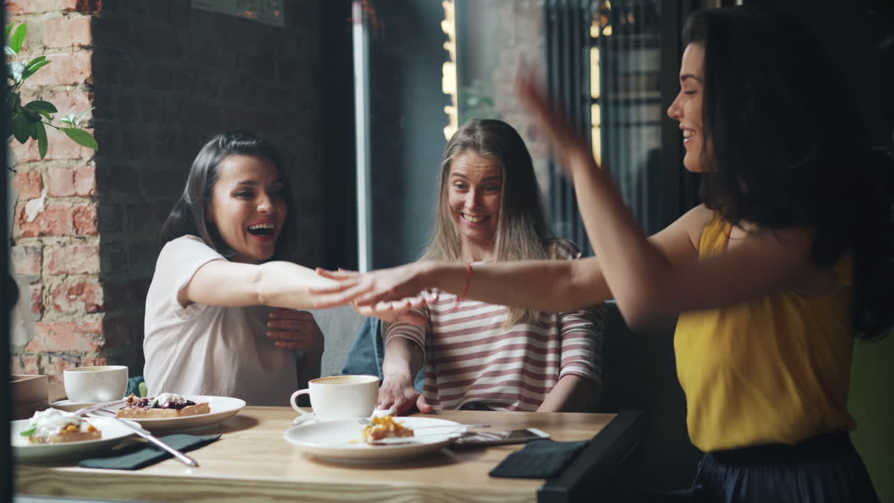 Friends enjoying a cafe breakfast