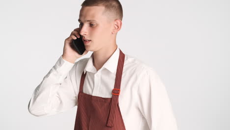 Young-blond-man-using-his-smartphone