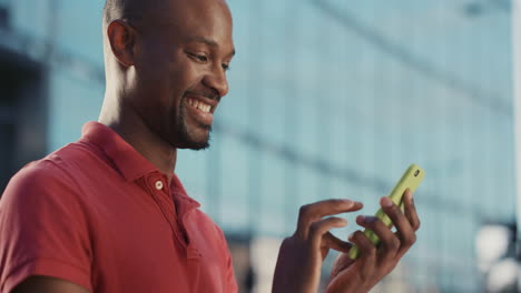 Slow-Motion-Portrait-of-african-american-man-using-smart-phone