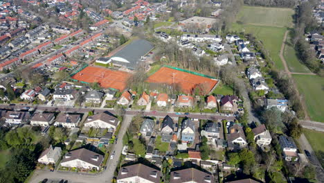 aerial of tennis court in small town