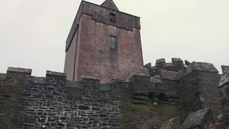 Doe-Castle-Tower-In-Creeslough,-County-Donegal,-Ireland---Low-Angle-Shot