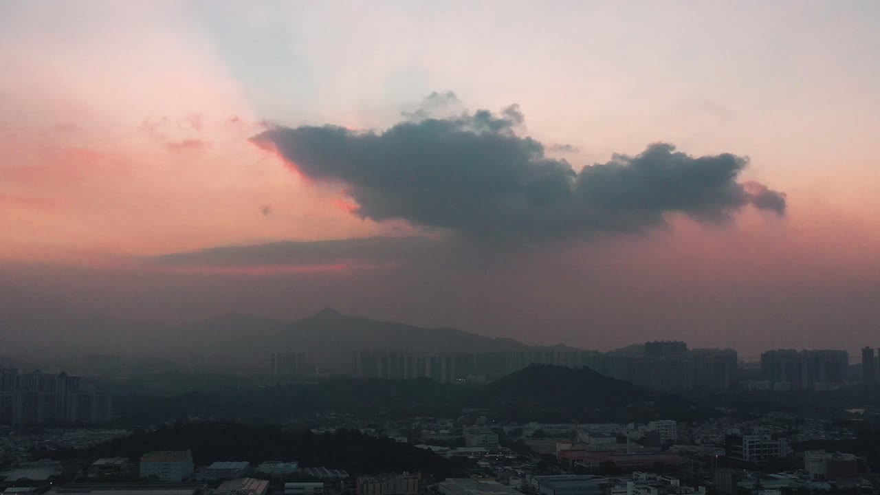 Aerial truck left Nam Sang Wai wetland town, hills in background, at golden hour with a colorful cloudy sky, Hong Kong, China