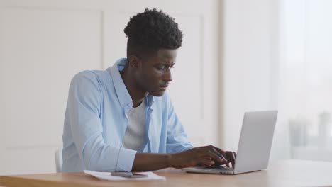 man working on laptop