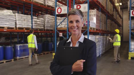 Portrait-of-a-female-warehouse-manager-at-work-4k