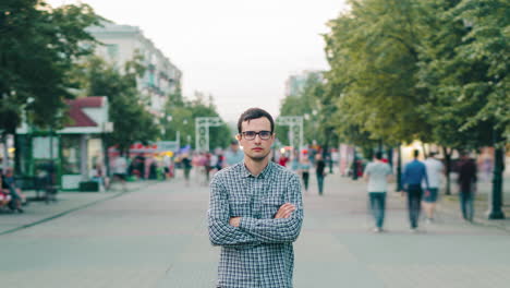 man standing on a city street