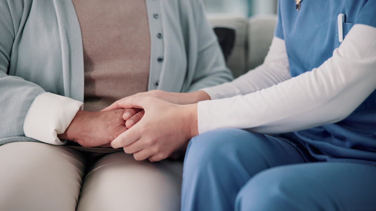 Caregiver providing support and comfort to elderly patient