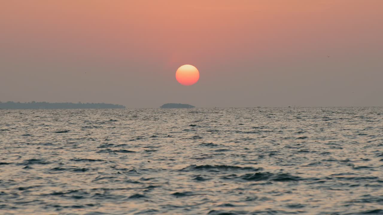 The sun rises above the waters of Lake Victoria in Homa Bay