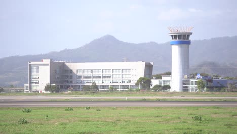 the air traffic controller (atc) building is visible at yogyakarta international airport.