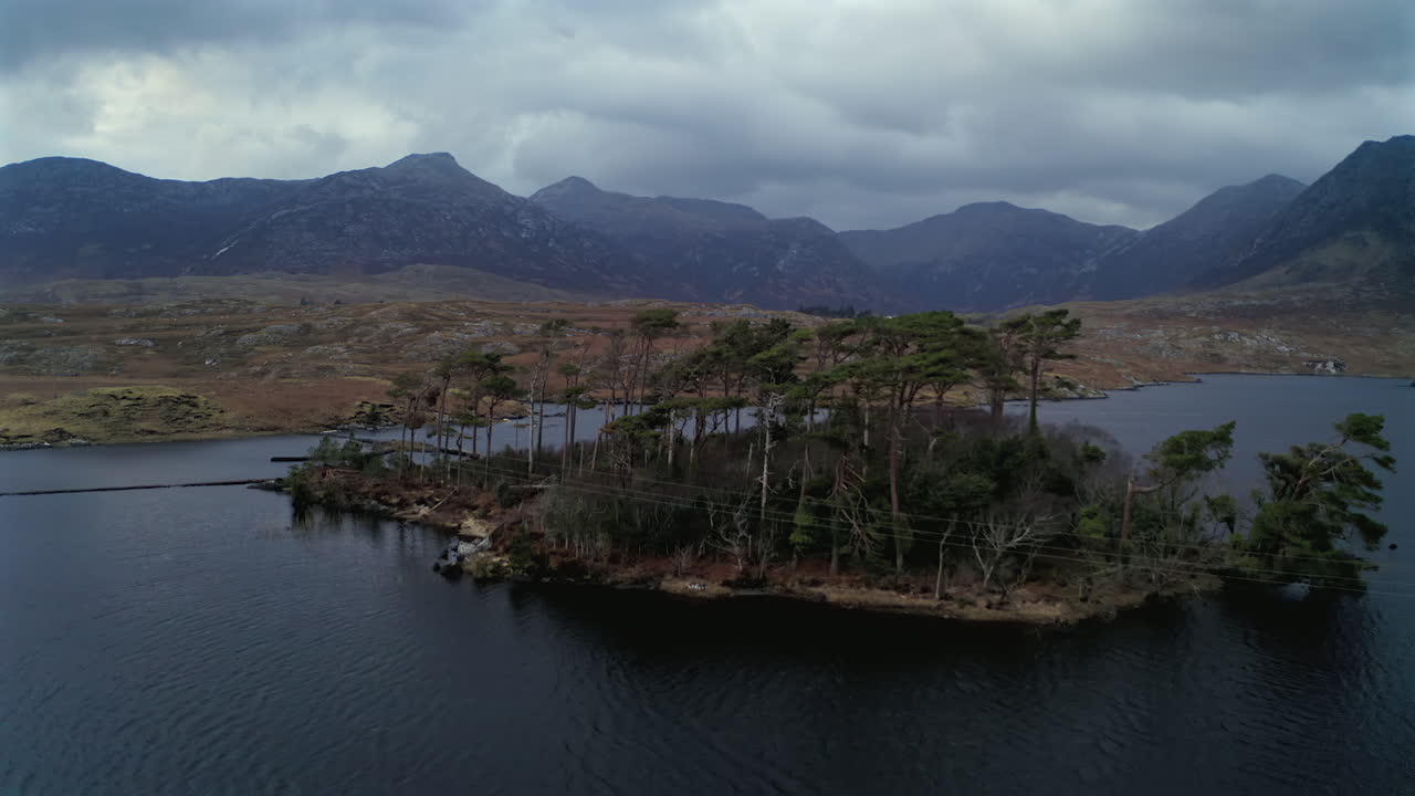 Aerial pullback of Pine Island at twilight, Connemara National Park, Ireland