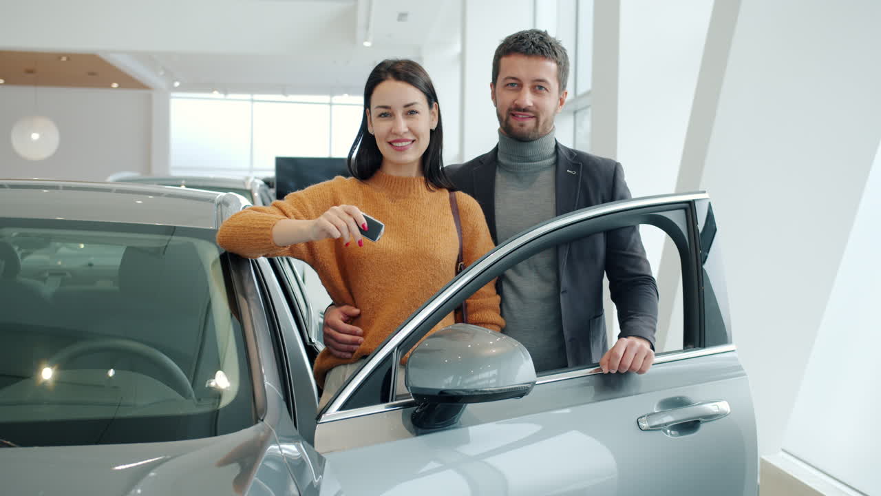 Happy Couple Purchases a New Car