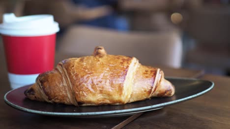 croissant and coffee at a cafe
