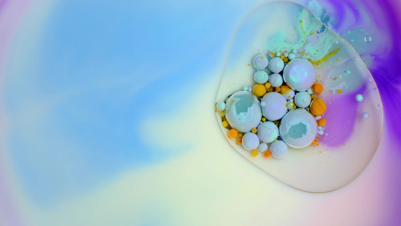 Colorful paint and bubbles abstract background 4k video