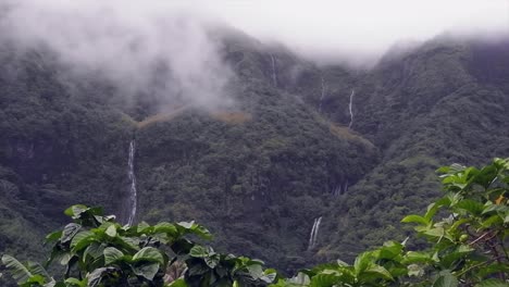 pan across low cloud jungle mountain waterfalls in french polynesia