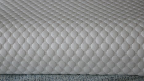 close-up of a white quilted mattress or fabric texture