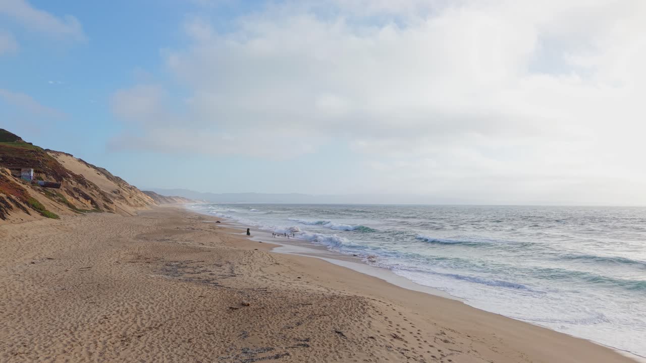 From high above, Fort Ord’s beach stretches out toward the horizon, its calm waves and dunes forming a serene seascape.