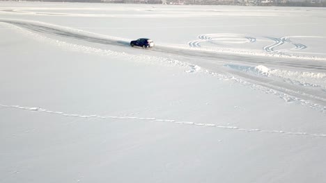 car driving on a frozen lake in winter