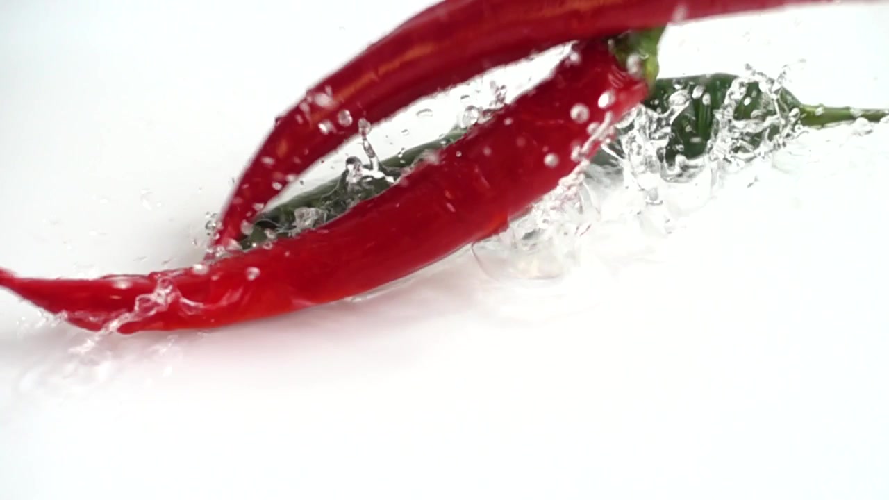 Fresh chili pepper. Slow motion.