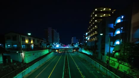 a night timelapse of the traffic jam at the downtown street in tokyo wide shot