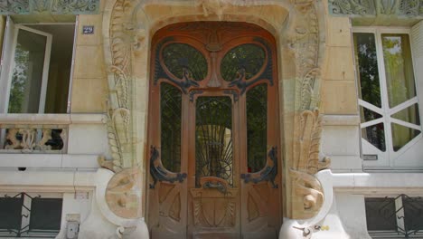 door of art nouveau building lavirotte, an apartment at 29 avenue rapp in 7th arrondissement of paris in france. close up, slider left