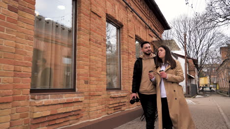 caucasian tourist couple walking through the city.