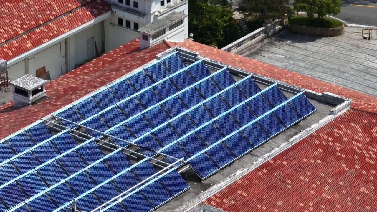 Sunlight mirroring from solar cells on a building roof, renewable energy in China