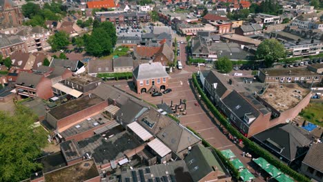 Fixed-drone-shot-view-of-the-center-of-Budel-village-in-Cranendonck,-Brabant-during-spring