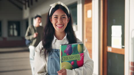 a young student with a chemistry book
