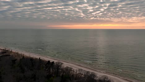 quickly panning from the peaceful clouds to the snowy dunes