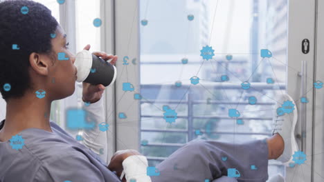 animation of network of connections with icons over african american female doctor