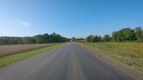 pov driving on county road with no center line and curves