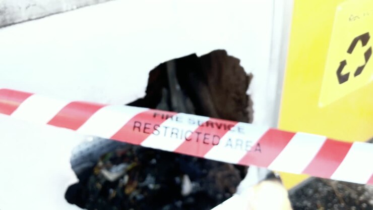 Fire Service Restricted Area tape cordons off suspected exploded bin, Brisbane Australia