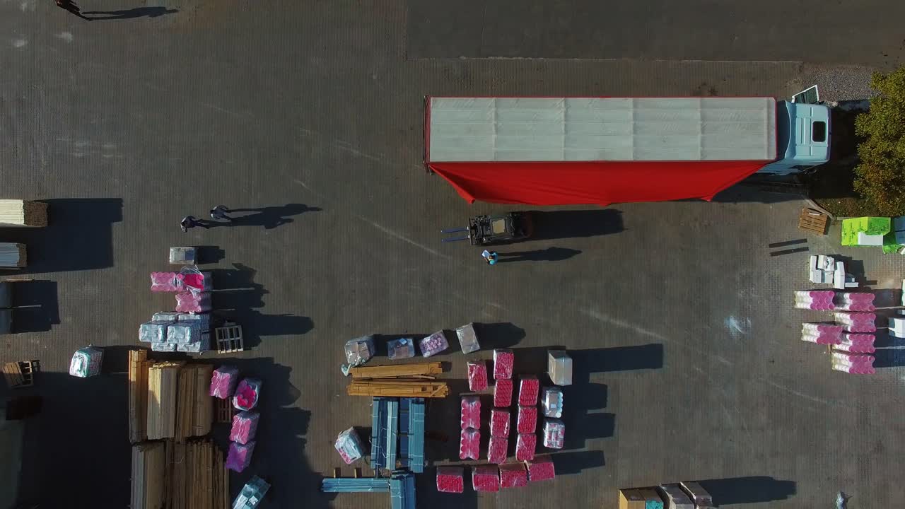 Logistics center from above. Aerial view of building materials warehouse