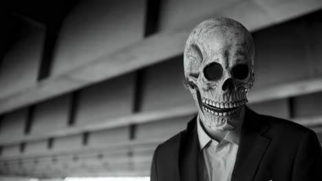 man in skull mask business suit
