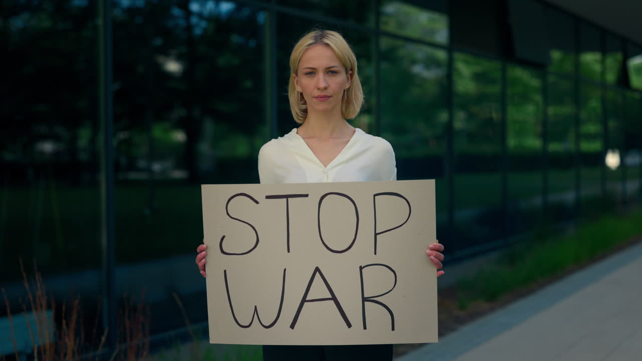 Woman Holding "Stop War" Sign